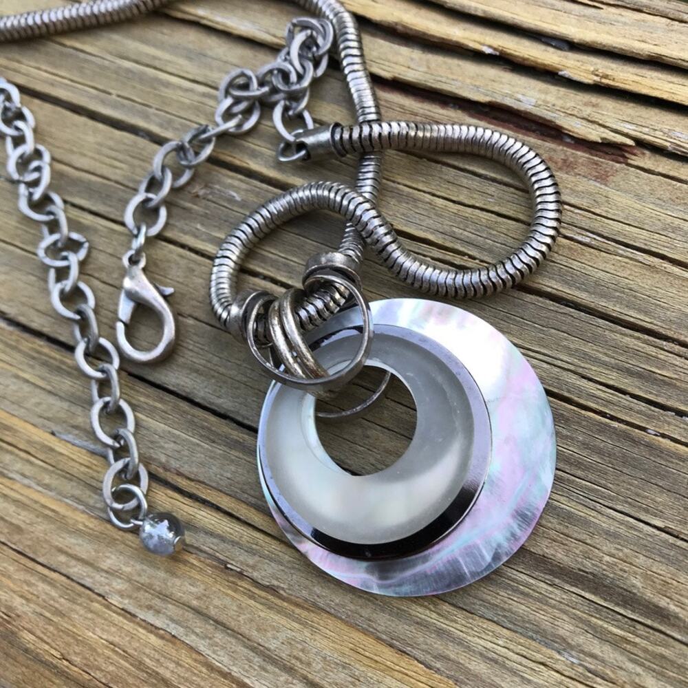 Mother of pearl mixed materials circle pendant silver tone necklace